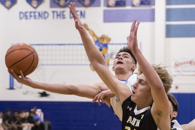 Sierra Vista’s Maka Ellis, behind, makes an acrobatic layup over Faith Lutheran’ ...