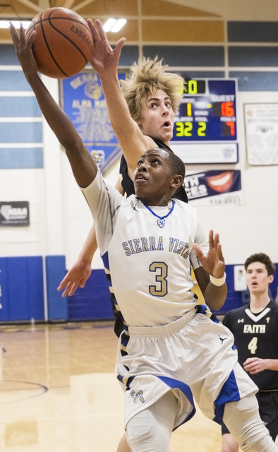 Sierra Vista’s Calvin Richards (3) drives past Faith Lutheran’s Nic Maccioni (24 ...