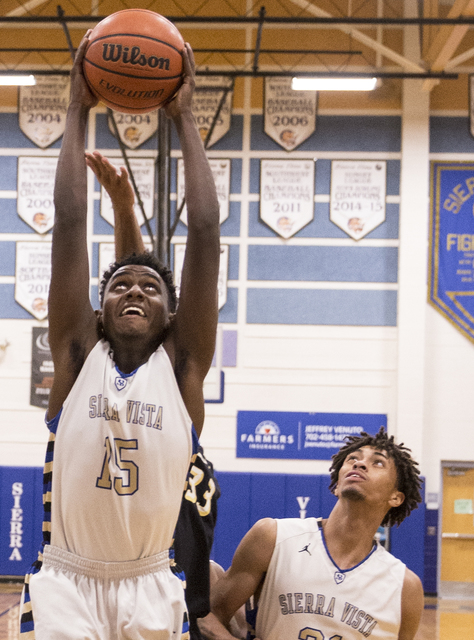 Sierra Vista’s Zekarias Kassaye (15) grabs a rebound on Tuesday, Nov. 29, 2016, at Si ...