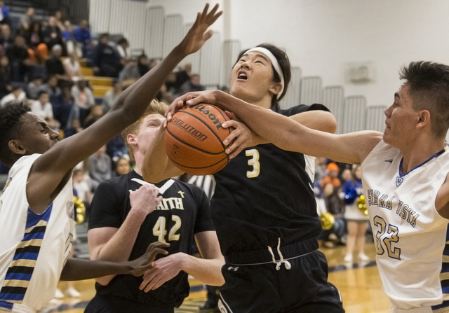 Faith Lutheran’s Josh Hong (3) grabs a rebound over Sierra Vista’s Maka Ellis (3 ...