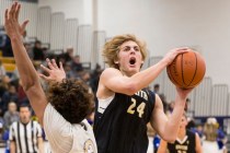 Faith Lutheran’s Nic Maccioni, right, drives around Sierra Vista’s Maui SeraJose ...