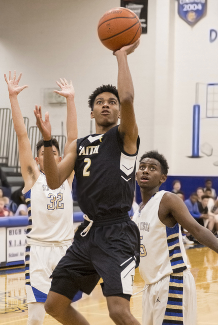 Faith Lutheran’s Jaylen Fox ( 2) drives past Sierra Vista defenders on Tuesday, Nov. 2 ...