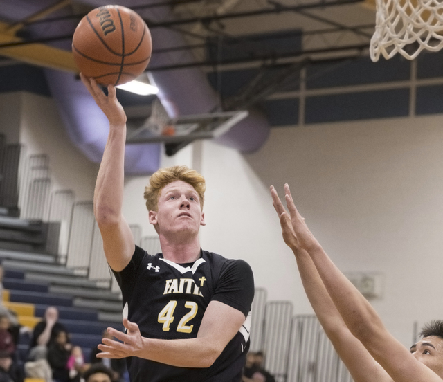 Faith Lutheran’s Elijah Kothe (42) drives to the basket past Sierra Vista’s Mak ...