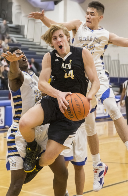 Faith Lutheran’s Nic Maccioni (24 ) drives past Sierra Vista’s Maka Ellis (32) o ...