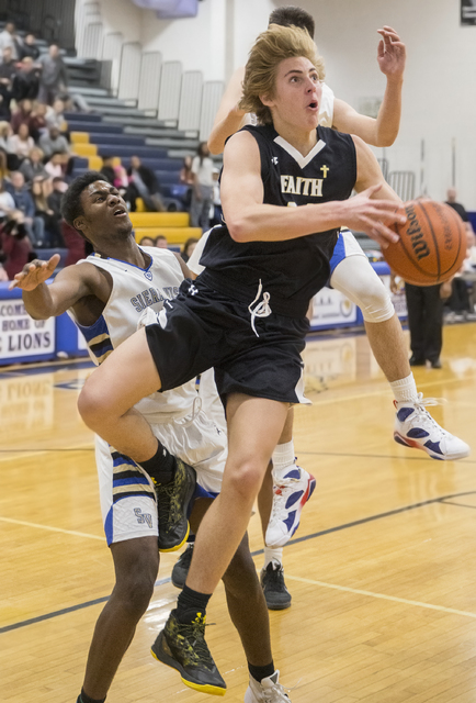 Faith Lutheran’s Nic Maccioni (24 ) drives past Sierra Vista’s Maka Ellis (32) o ...