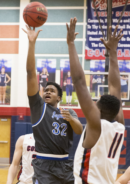 Desert Pines’ Derrick Coleman (32) shoots over Coronado’s Will Weems (11) on Mon ...