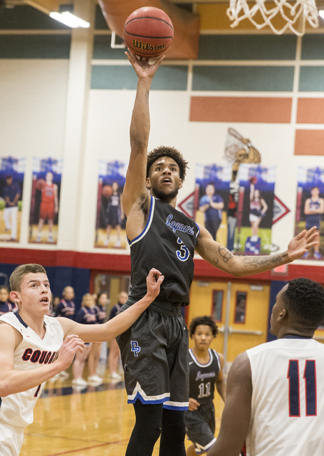 Desert Pines’ Trevon Abdullah-Booker (3) shoots over Coronado’s Will Weems (11) ...