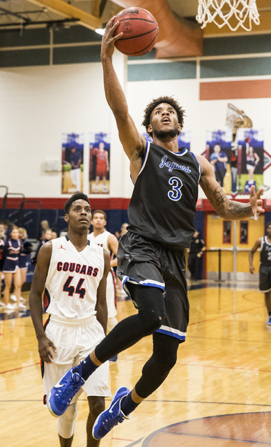 Desert Pines’ Trevon Abdullah-Booker (3) drives to the basket past Coronado’s Ta ...