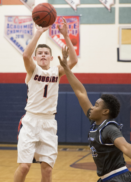 Coronado’s Trey Hurlburt (1) shoots over a Desert Pines defender on Monday, Dec. 12, 2 ...