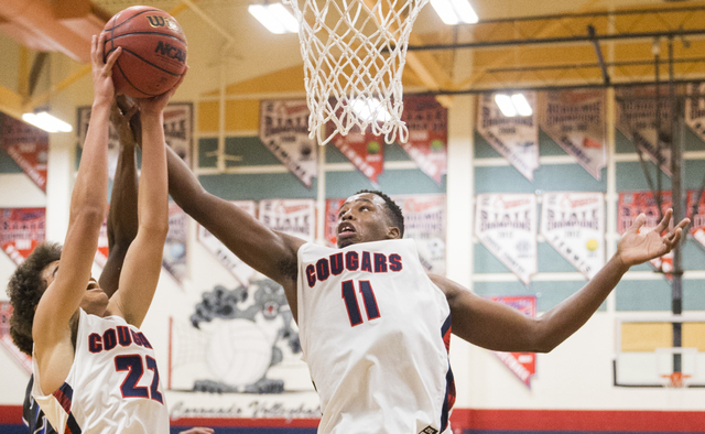 Coronado’s Will Weems (11) and Patrick Simms (22) compete for a rebound on Monday, Dec ...