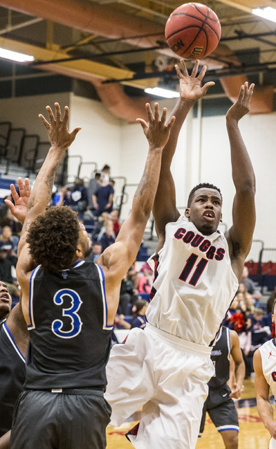 Coronado’s Will Weems (11) shoots over Desert Pines’ Trevon Abdullah-Booker (3) ...