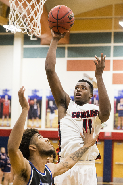 Coronado’s Will Weems (11) shoots over Desert Pines’ Trevon Abdullah-Booker (3) ...