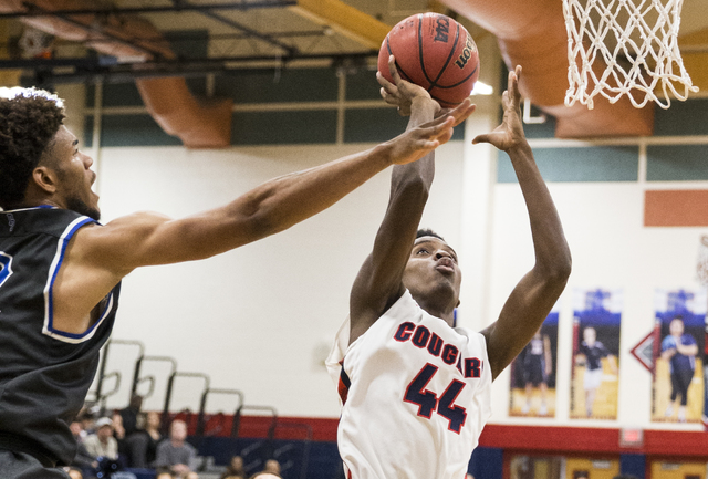 Coronado’s Taieem Comeaux (44) shoots over Desert Pines’ Trevon Abdullah-Booker ...