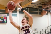 Coronado’s Kennedy Koehler (30) drives past Desert Pines’ Jalen Graves (12) on M ...