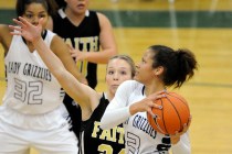 Spring Valley guard Essence Booker (3) goes up for a layup against Faith Lutheran’s Mo ...