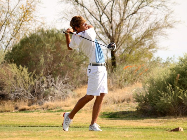 Boulder City golfer Luke Logan follows through. (Laura Hubel/Boulder City Review)