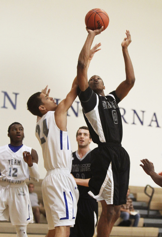 Findlay Prep forward Horace Spencer (0) shoots over Team Pennsylvania’s Miko Jenkins ( ...