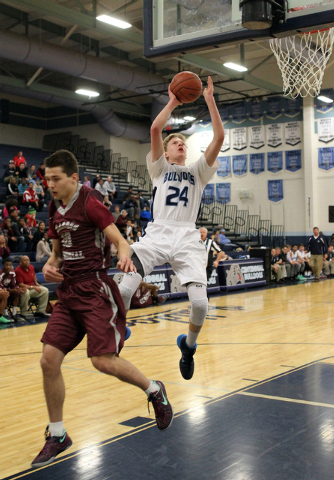 Centennial forward Garett Scheer (24) goes up for a shot past Cimarron-Memorial guard Austin ...