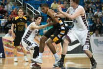 Clark’s Sherron Wilson (35) tries to break through Elko’s Eric Klekas (13) and B ...