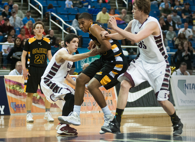 Clark’s Sherron Wilson (35) tries to break through Elko’s Eric Klekas (13) and B ...