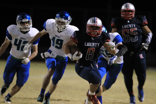 Liberty’s Spencer Wilson pulls away from the Green Valley defense on Friday. Wilson ru ...