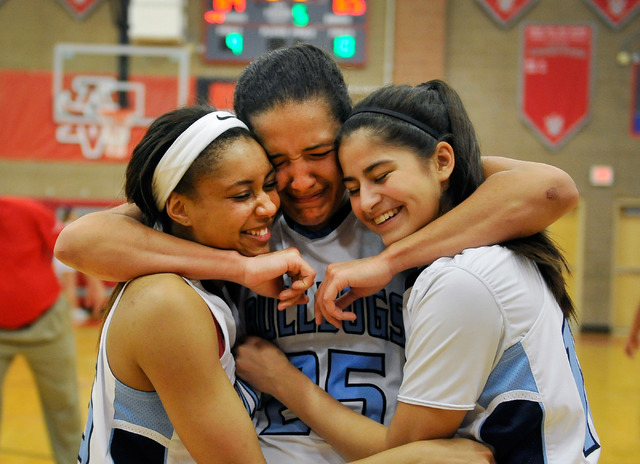 Centennial players from left, Alex Dockery, Karina Brandon and Sarah Kruthaupt embrace after ...