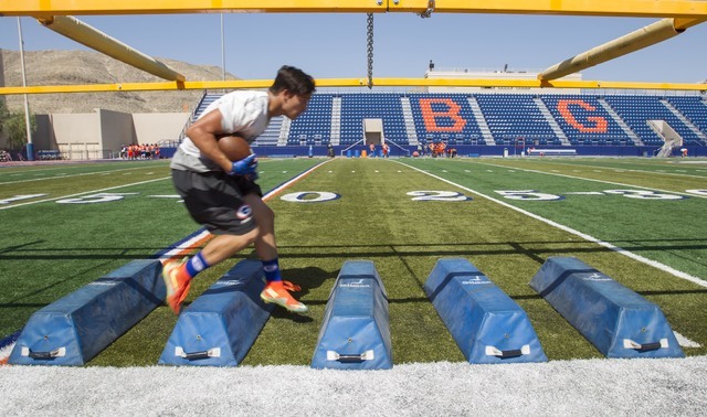 Bishop Gorman running back Baggio Ali Walsh (7) runs a drill during team practice at Bishop ...