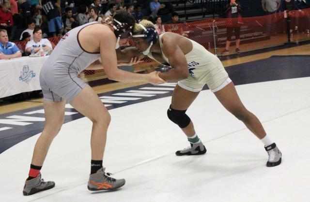 Cimarron-Memorial’s Jesse Ramos and Shadow Ridge’s Elvin Cruz lock up heads in t ...