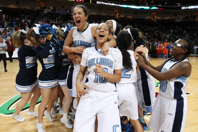 Jayden Eggleston (10), Karina Brandon (left) and Tanjanae Wells (00) celebrate along with th ...