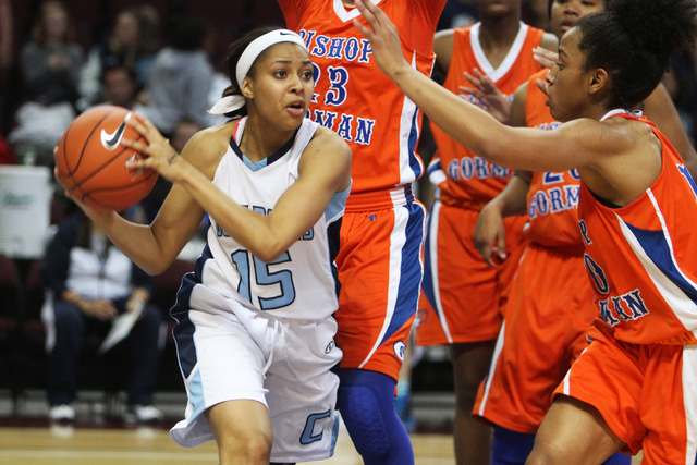 Centennial guard Alex Dockery looks to pass out of Bishop Gorman traffic during their Divisi ...