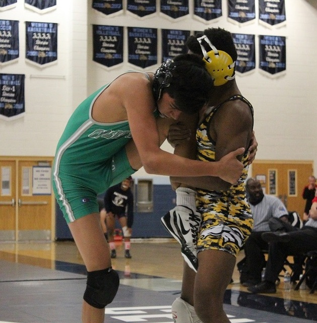 Clark’s Melekte Demdemyanos, right, attempts to take down Green Valley’s David K ...