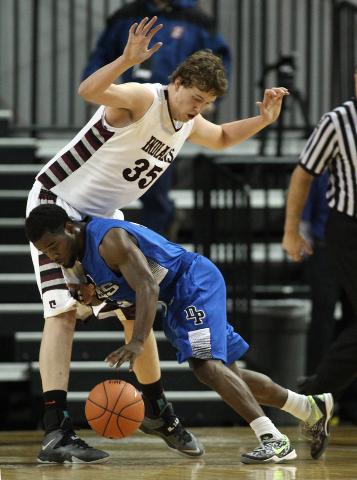 Desert Pines’ Malik Davis tries to push past Elko defender Brian Pearson during the Di ...