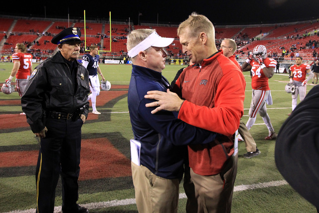 Nevada head coach Brian Polian and UNLV head coach Bobby Hauck embrace after their game Satu ...