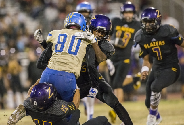 Sierra Vista wide receiver Chevy Eliu (80) is gang tackled by Durango defenders on Friday, O ...