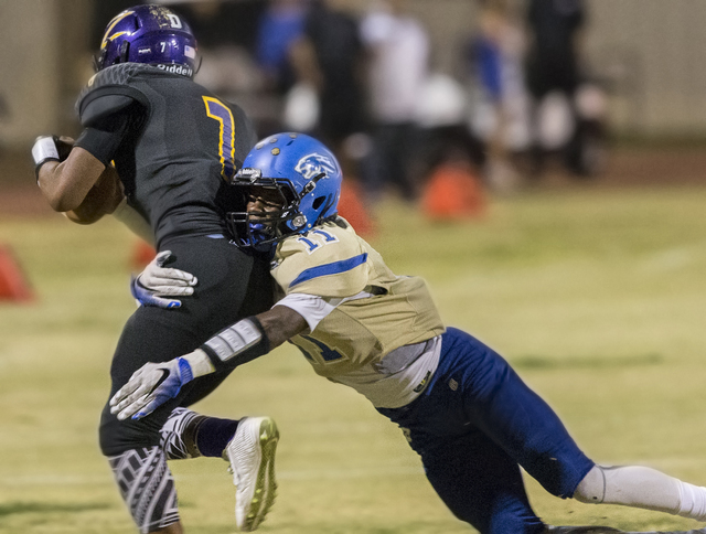 Sierra Vista defender Damaen Bentley (11) tackles Durango’s T.K. Fotu on Friday, Oct. ...