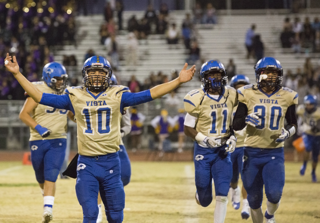 Sierra Vista’s Oscar Aliaga (10) celebrates with teammates after knocking off Durango ...