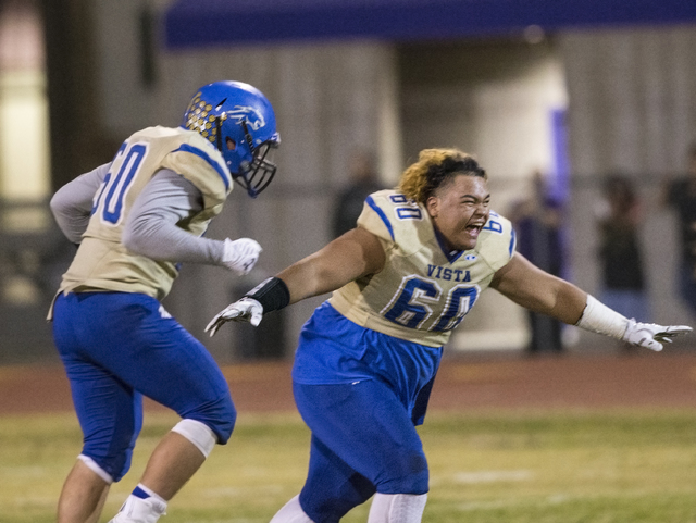 Sierra Vista’s Keki Faatiliga (60) celebrates with teammates after knocking off Durang ...