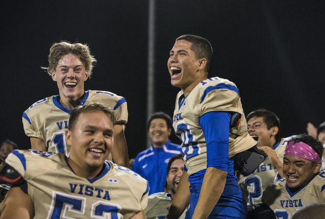 Sierra Vista’s Oscar Aliaga (10) celebrates with teammates after knocking off Durango ...