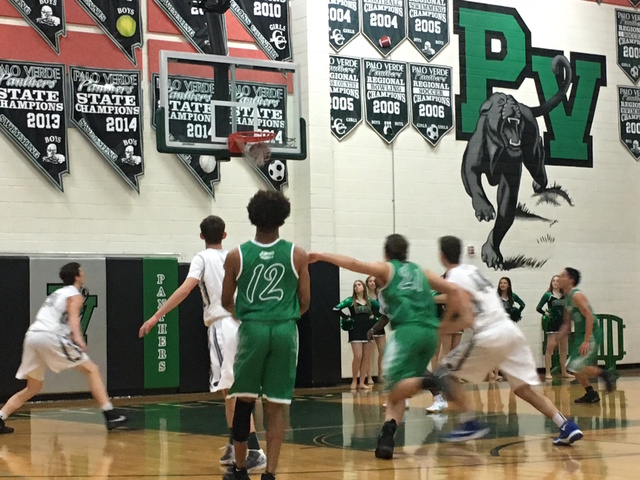 Green Valley senior Eric Johnson (12) watches his 3-point shot go in against Palo Verde duri ...