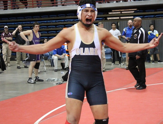 Clark’s Michael Hervis lets out a furious roar after winning the Division I-A 195-poun ...