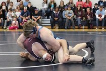 Centennial’s Hunter Brown works his opponent from Cimarron-Memorial, during Saturday’s 1 ...