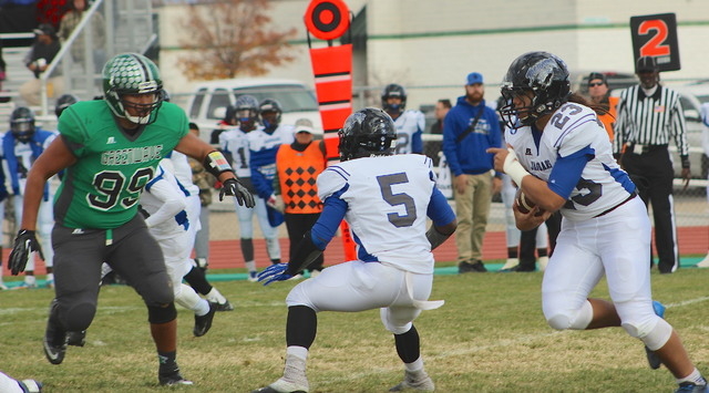 Churchill County’s T.J. Mauga (99) waits for Desert Pines’ running back Trevor Nafoa ...