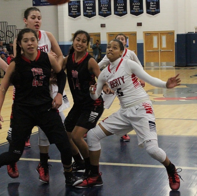 Liberty’s Jaelyn Royal battles underneath the basket during the Las Vegas Holiday Classic, ...