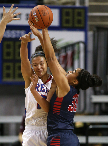 Liberty’s Paris Strawther pressures Shalen Shaw of Reno during the Division I champion ...