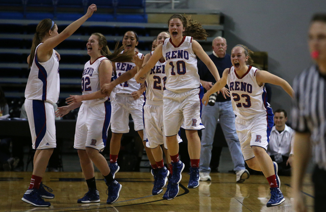 The Reno Huskies clear the bench after defeating the Liberty Patriots 50-39 to clinch the Di ...