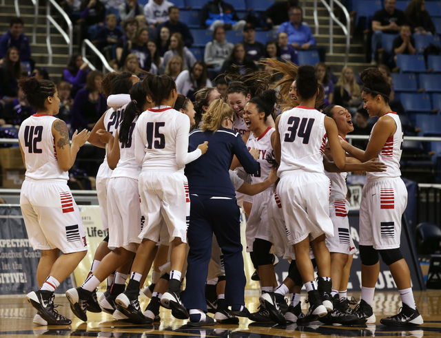 Liberty’s girls basketball team celebrates after defeating Bishop Manogue 43-33 in a D ...