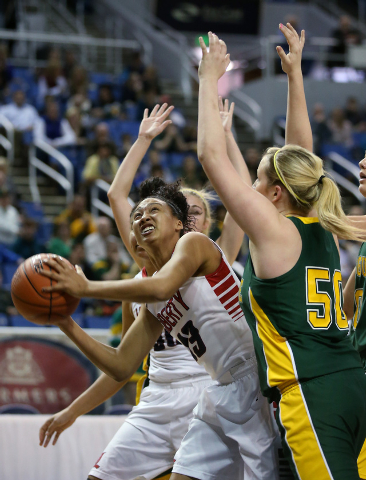 Liberty’s Aubre’ Fortner looks to shoot around Bishop Manogue defender Madison L ...