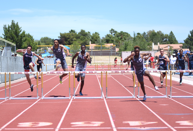 Liberty’s David Washington, third from right, won the 300-meter hurdles at the Divisio ...