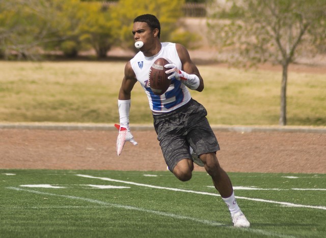 702 Elite’s Malik Hausman (13) celebrates after intercepting the ball during their gam ...