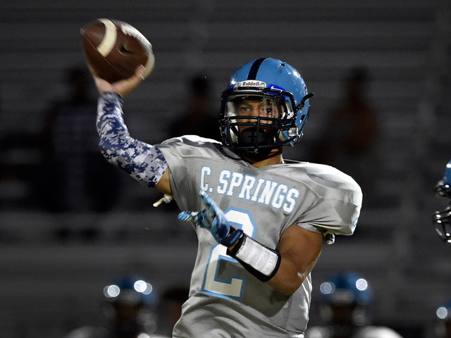 Canyon Springs quarterback Diamante Burton looks to pass the ball against Sunrise Mountain d ...